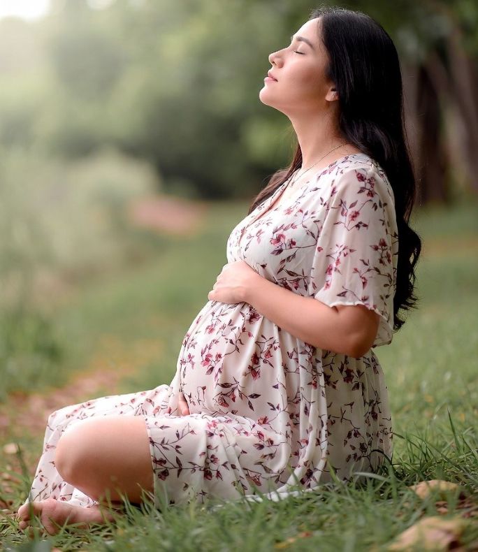 pregnant woman relaxing outdoor